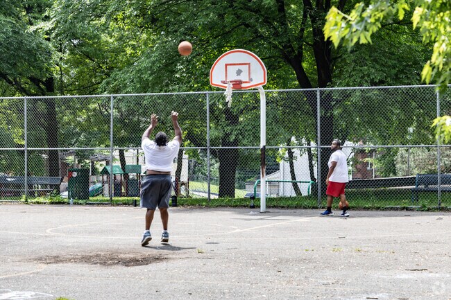 Friends meet to shoot some hoops on the courts at Hunter Park.