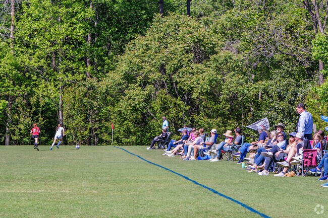 Friends and family in East Fork Deep River enthusiastically support a girls' soccer match.