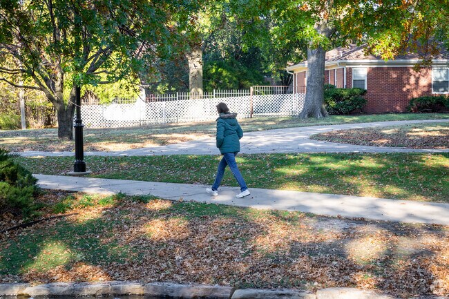 This lady is enjoying an afternoon walk near Village.