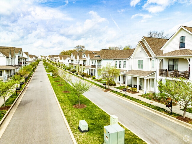 Two-story Craftsman homes with wide porches in the Talbot's Corner. neighborhood.