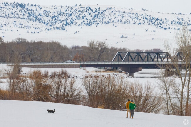 A Livingston couple walk their dog along the Yellowstone River.