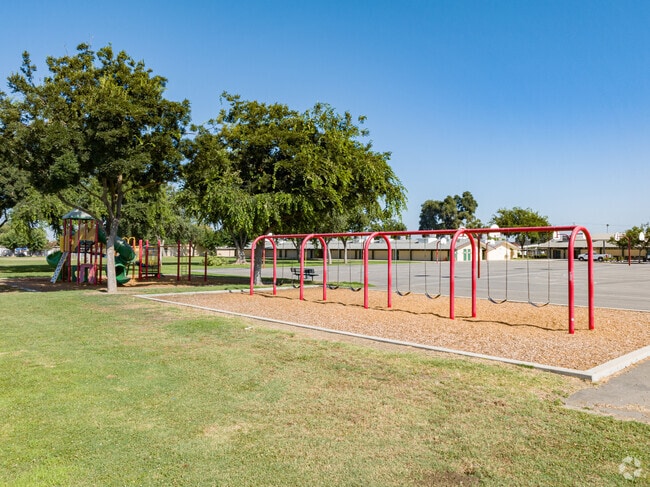 Play area and swings near the basketball courts of Mineral King Elementary School in Visalia.