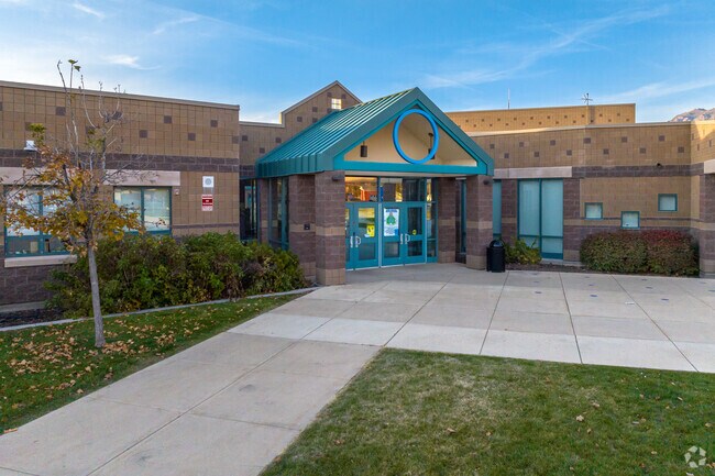 A teal roof and circle mark the entrance at Lincoln Elementary School in Ogden.