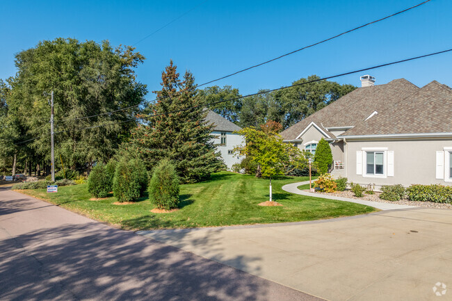 Pine and oak trees line the streets leading to a rustic feel to the Old Orchard neighborhood.