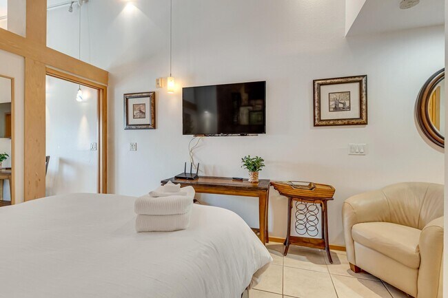 Watch Television While Relaxing In Bed