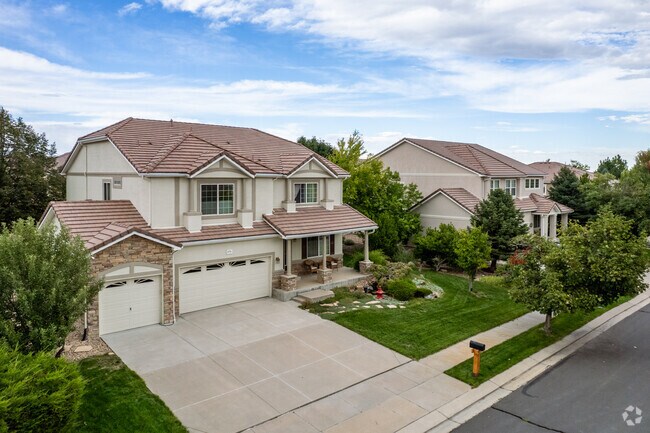 Distinctive spanish revival homes with three car garages are available in Broadlands, Colorado.