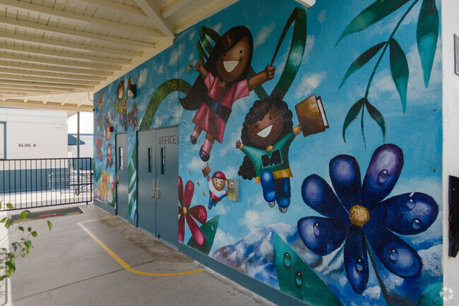 A mural at Maxson Elementary welcomes children entering the school.