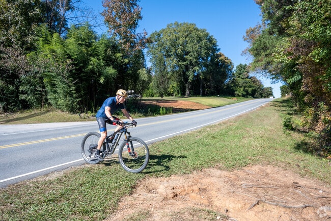 You can enjoy riding your mountain bike on the trails near the lake in The Orchard.