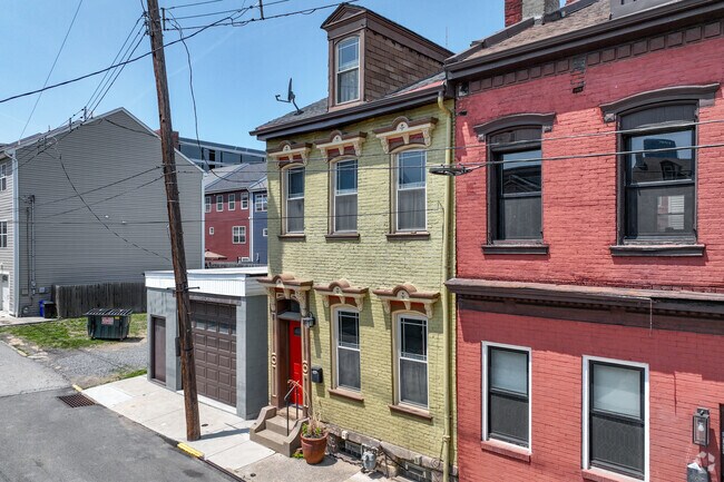An Italianate-style home in Deutschtown has an attached garage.
