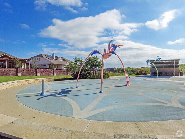 Rabbit Hill is a 12+ acre park featuring a splash pad. A towering spider sculpture blasts water.