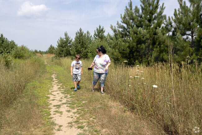 A mother and child explore California Fields Wildlife Area in Hillis.