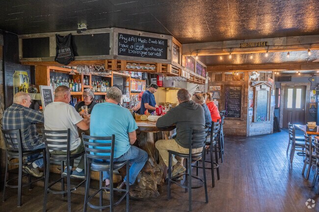 Head to the Pine Tree Bar and Grill for a drink near Cohassett Beach.