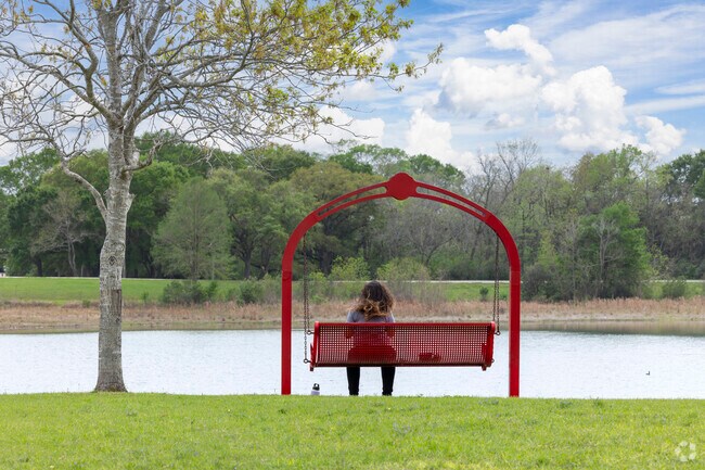 Birdwatchers spot various avian species in Tom Bass Regional Park's natural habitat.