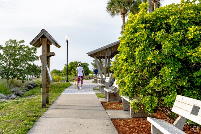 Sebastian locals enjoy a walk along the paved pathways at Riverview Park.
