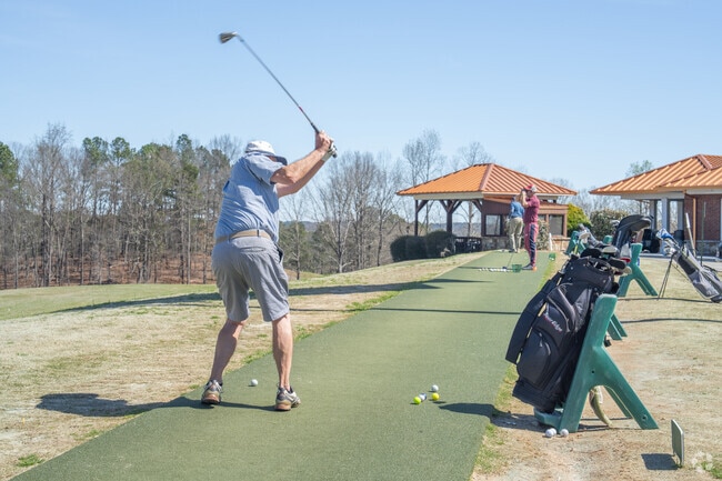 Residents can spend some time on the driving range at Sugar Hill Golf Club.