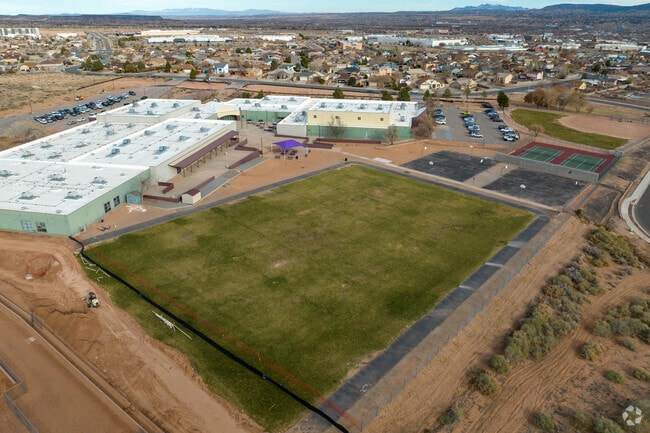 Grass field, basketball and tennis courts at Mountain View Middle School.