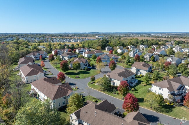 Chestnut Hill homes sit among wooded landscapes and quiet streets.