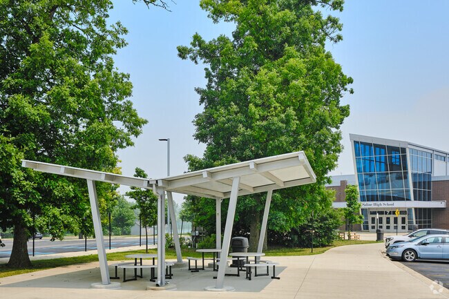 Saline High School features multiple covered waiting areas for school buses.