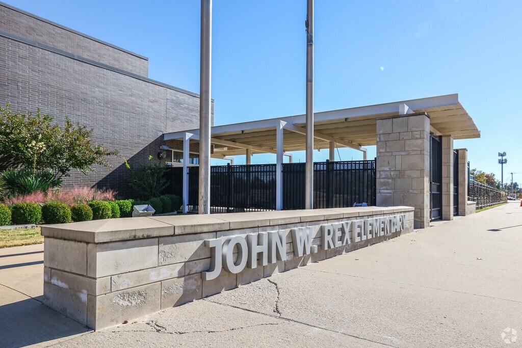John Rex is easily seen by stone signs near the building.