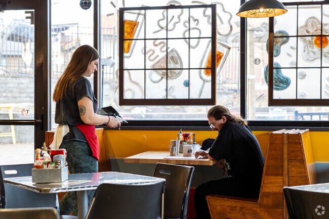 Cafe Berlin serves breakfast and has live music and events in North Central.