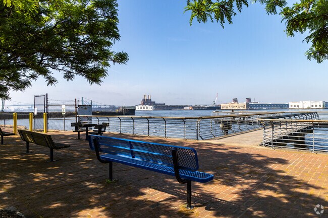 Benches in the shade to sit & stare out onto the Delaware River at Michael Doyle Fishing Pier.