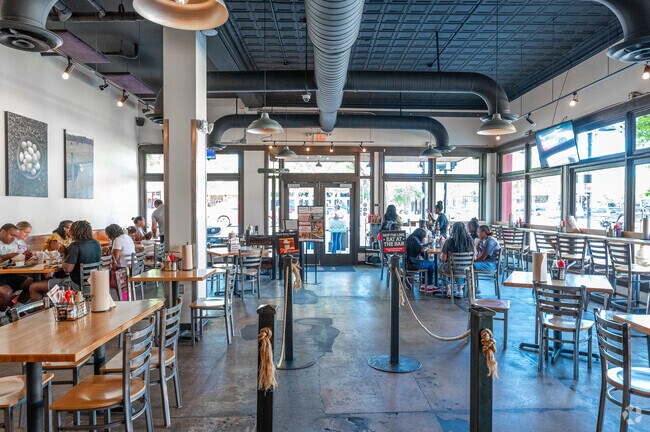 Inside the Farmhaus restaurant, you can enjoy open seating for your large group in West End.