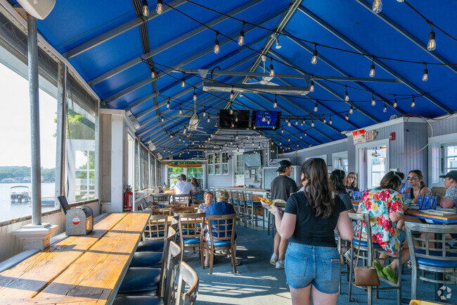 Enjoy good food, drink, and river views at Four Winds Lynnapesaukee  near Lower Broadway.