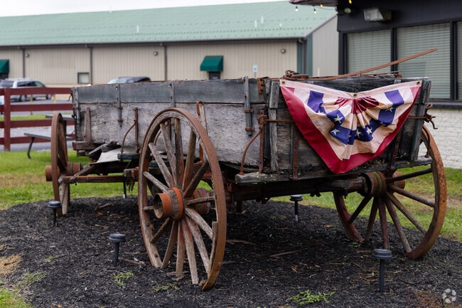 Historic wagon in Greene displays patriotic colors.