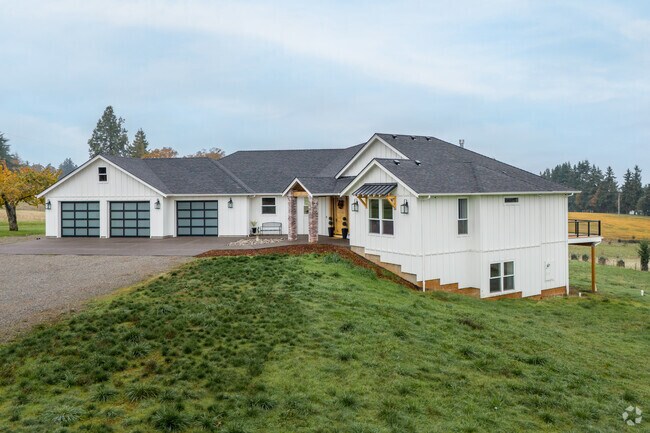 This Modern-Contemporary house design sits on a large lot in Spring Valley, Oregon.