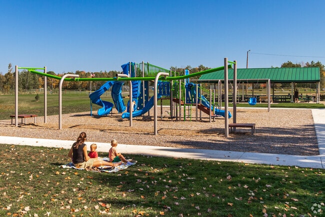 Families enjoy the playground and amenities at Rice Lake City Park.