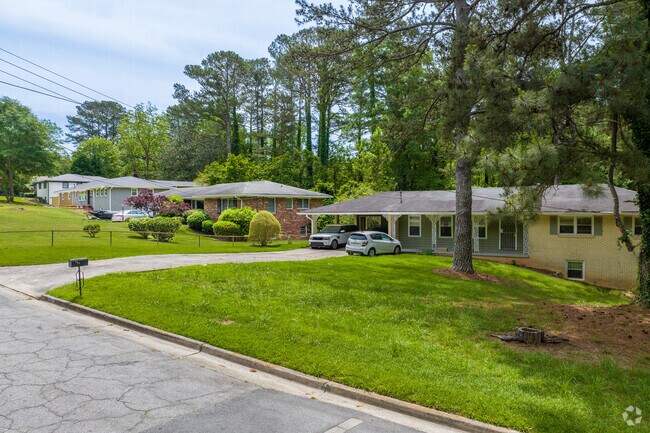 Peyton Forest's peaceful streets reveal a mix of homes built in the 1960s and 70s surrounded by greenery, underscoring the area's well-established community.