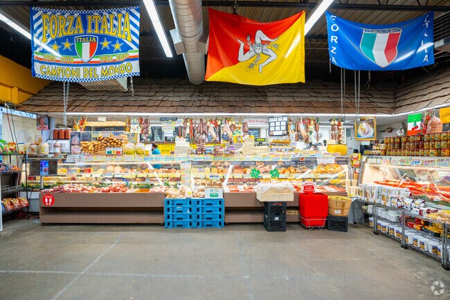 Shoppers pick up a sandwich from New Deal Fruit in Revere.