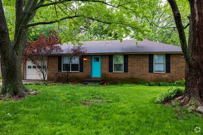 A ranch style home with a brightly painted front door greets residents in Nixa.