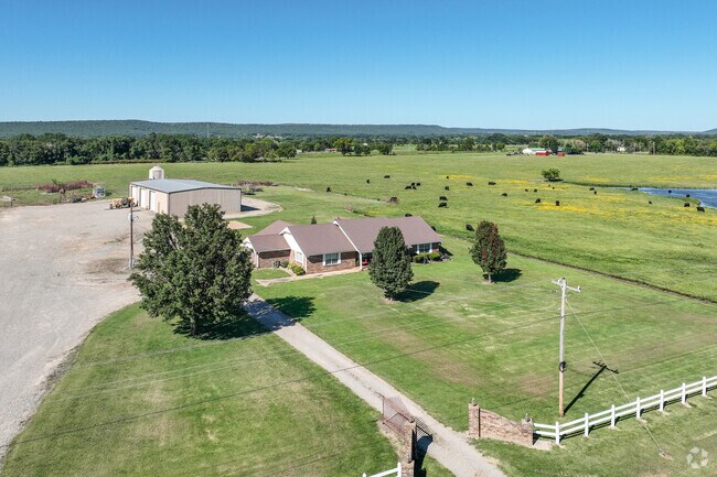 Find sprawling farm and ranch land on the outskirts of Sallisaw.
