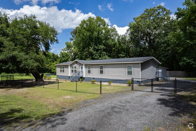 Newly constructed manufactured homes in Sterling feature fresh landscaping and fenced yards.