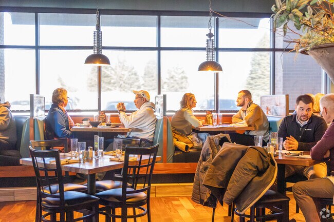 Savor gourmet dishes in a cozy atmosphere at Stokin Goat near Champions Run.