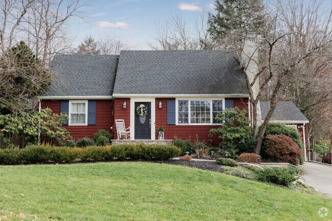 Pines Lake features charming Cape Cod homes that blend classic architecture with lakeside living.