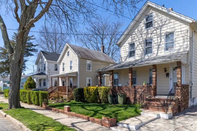 Tree-lined streets in Freehold feature modest homes.