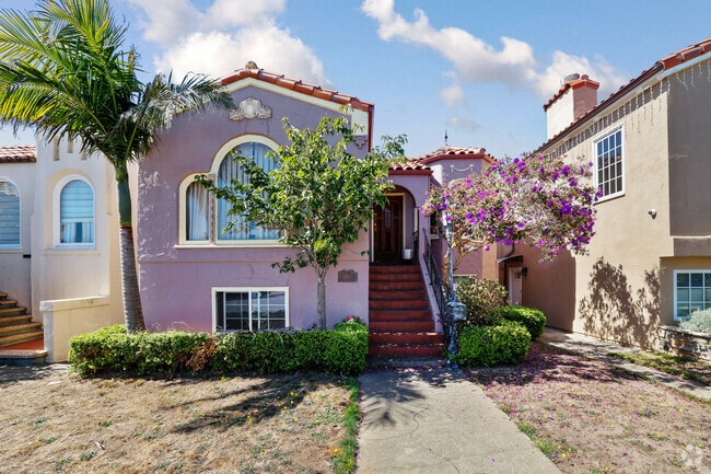 The vivid exterior of this Merced Manor home is accentuated by beautiful landscaping.