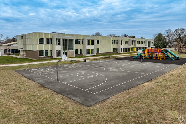 Memorial Elementary School features a playground and basketball court.