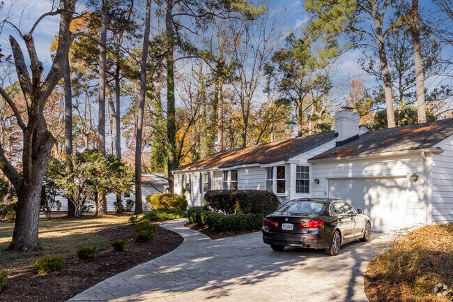 Large, mature trees shade this home in Bay Colony-Cavalier Park.
