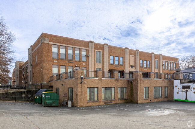 Murals are painted on the exterior of E.J. Harrington School in Lynn.