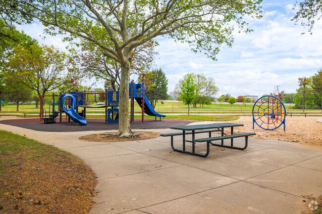 Picnic tables and a playground at The Hydes half-acre Skyline Park.