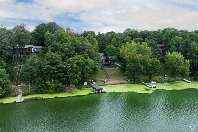 Private docks and views of Tainter Lake are available at waterfront properties with wide ranging styles.
