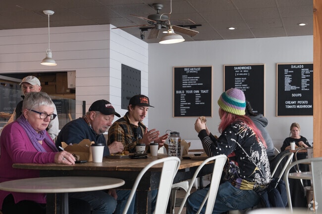 Residents enjoy hot coffee and breakfast at Upper Crust Bake House on a cold wintry day.