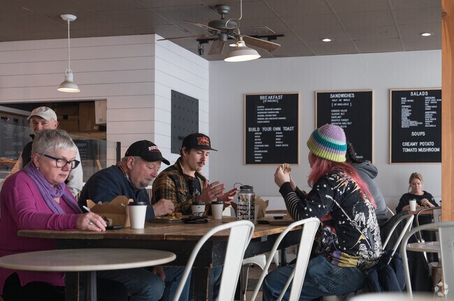 Residents enjoy hot coffee and breakfast at Upper Crust Bake House on a cold wintry day.