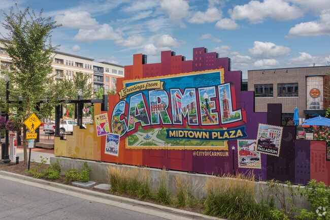Midtown Plaza features a colorful mural city sign in downtown Carmel near East Carmel.