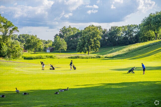 People enjoy golfing on the public course at Meadowbrook near Rolling Green - Hilldale.