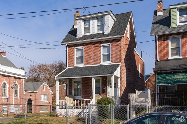 Vandever Ave homes often feature classic brick architecture, dormer windows and fenced yards.