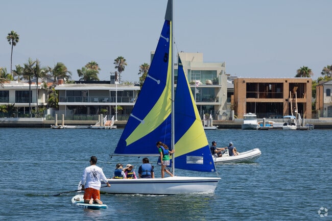 The local sailing club is always practicing in the harbor in Peninsula Long Beach.